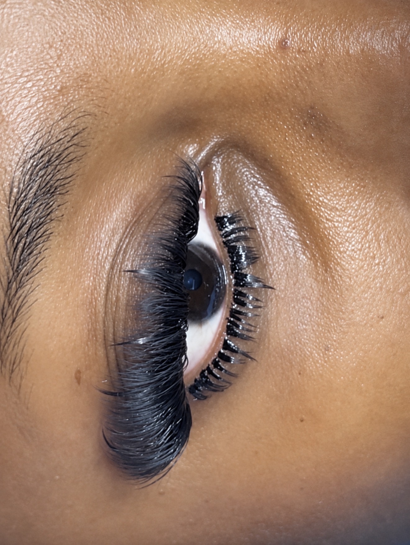 Close-up of a soft wispy lash set with bottom lashes