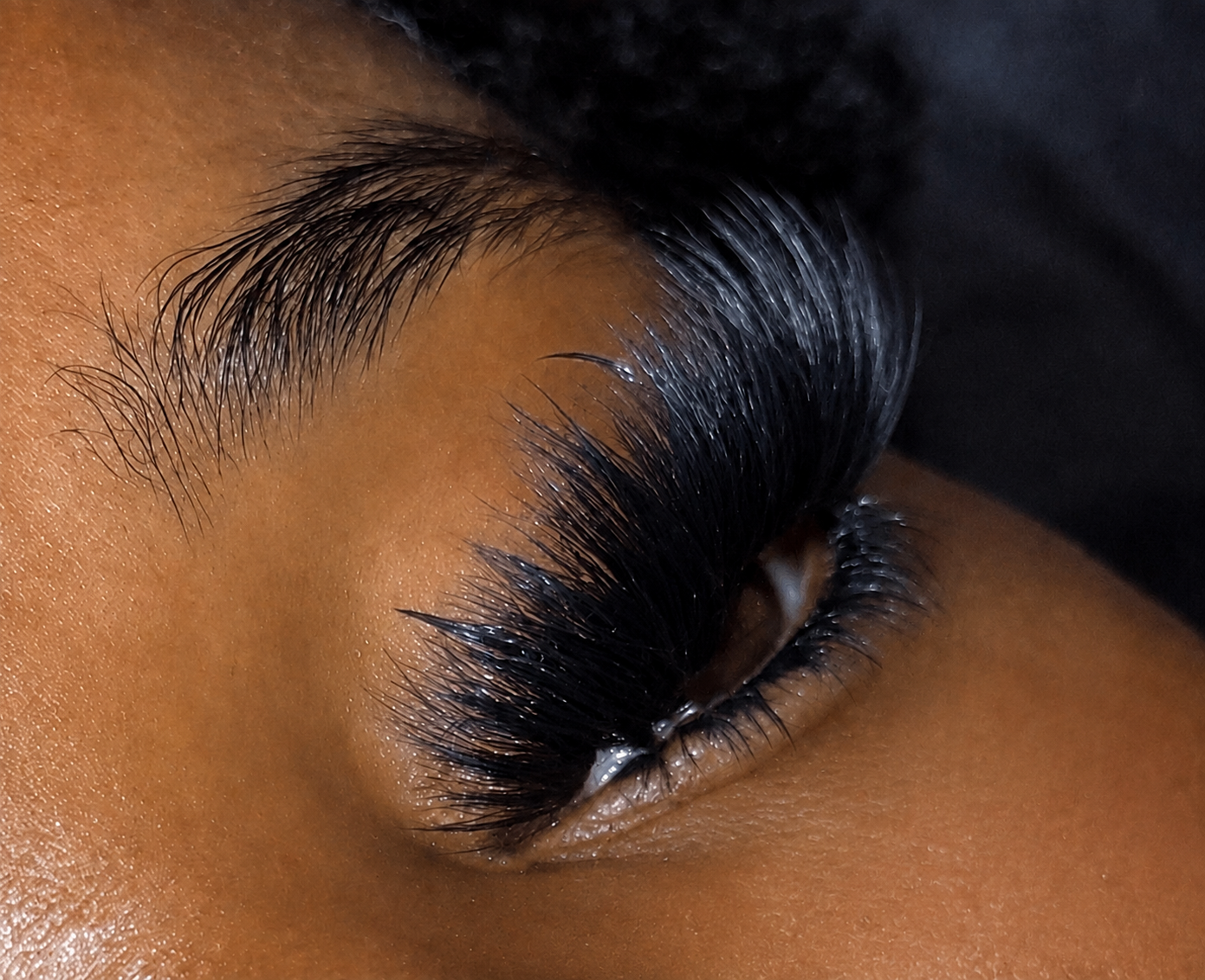 Close-up of a dramatic mega volume lash set with bottom lashes